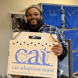 Jeanette, a cat transferred to Cat Adoption Team from Multnomah County Animal Services, goes home with her new adopter during the Adopt ASAP event