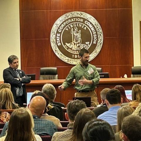 Officer Brian Wammack (front - right) presents with Oregon Animal Cruelty Deputy District Attorney Jake Kamins (front-left)